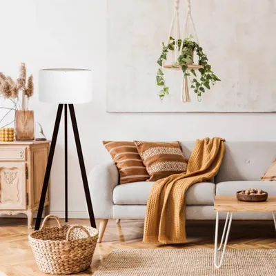 A living room scene with a floor lamp, sofa, and coffee table.