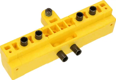 A yellow jig for drilling holes in doors.