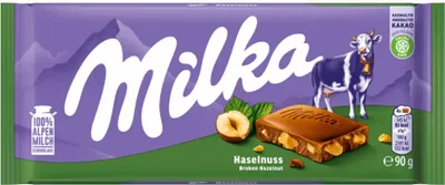 Produktbild von Milka Alpenmilch Schokolade mit knackigen Haselnussstückchen 90g