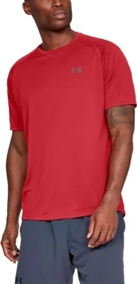 A man wearing a red t-shirt and grey shorts, posing for a product shot.