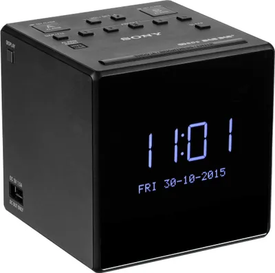 A black Sony digital clock radio with a blue digital display showing the time and date.