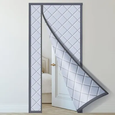 A quilted door curtain is shown partially open, revealing a doorway into a room.