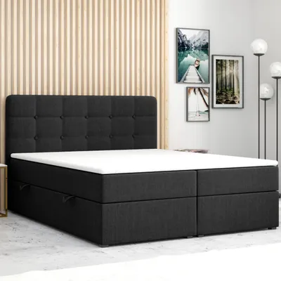 A bedroom setting with a bed.