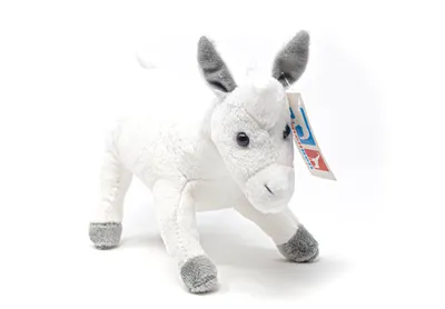 A plush toy donkey on a white background.