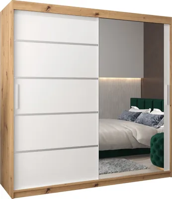 A bedroom scene reflected in a mirrored wardrobe door.