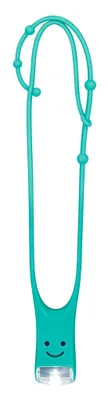 A turquoise-colored reading light with a smiley face design.