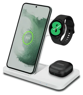 A white wireless charging station with a smartphone, smartwatch, and earbuds case on it.