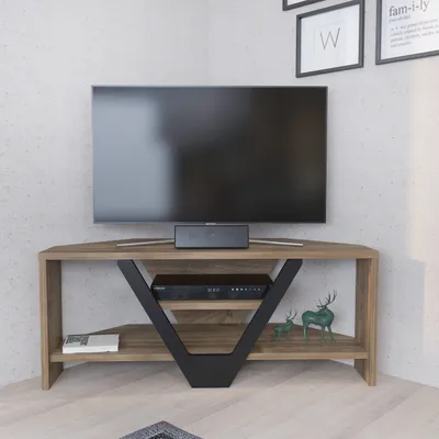 A corner TV stand with a television and media console on it, placed in a room with a textured wall.