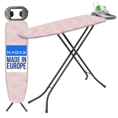 A KADAX ironing board with an iron resting on an iron rest, set against a white background.