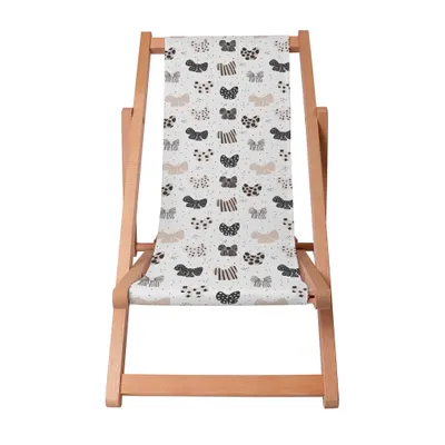 A wooden deck chair with a patterned fabric seat.