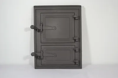A dark gray cast iron door with two panels and two handles, set against a white background.