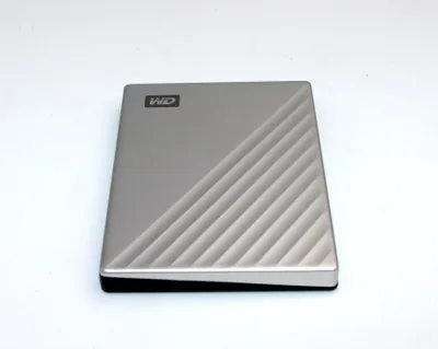 A silver Western Digital My Passport Ultra external hard drive is shown on a white background.