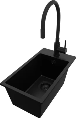 A black granite kitchen sink with a black faucet against a white background.
