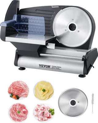 A commercial slicer with various food items and accessories.