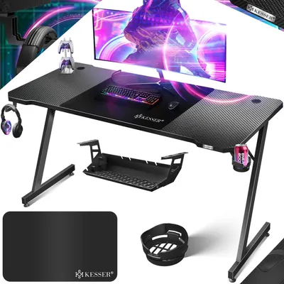 A gaming desk setup with a monitor, keyboard, mouse, headphones, and accessories, presented in a dynamic, promotional style.