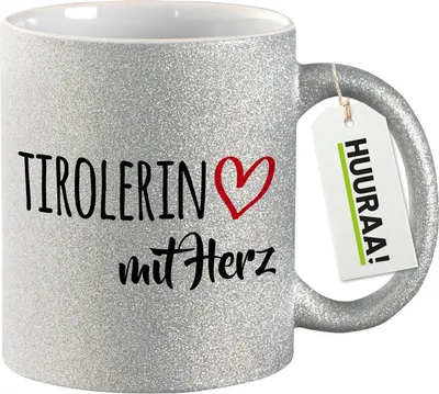 Produktbild von Huuraa Glitzertasse Tirolerin mit Herz 330ml Silber Keramik Kaffeebecher Geschenkidee