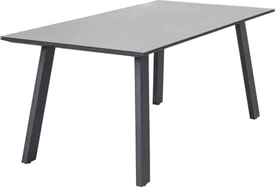 A rectangular table with a concrete-look top and dark gray metal legs, isolated on a white background.