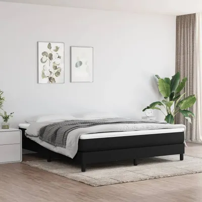 A bedroom scene with a bed and decorative elements.