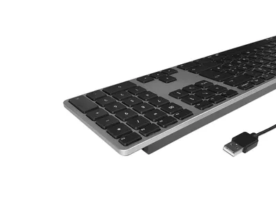 A close-up, angled view of a full-size wired keyboard with a numeric keypad, set against a plain white background. The keyboard has a silver-colored frame and black keys. A USB cable extends from the right side of the keyboard.