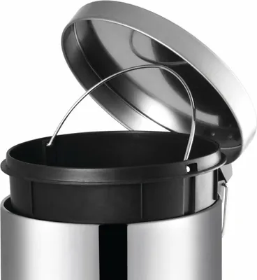 Close-up of the top of a stainless steel trash can with the lid open.