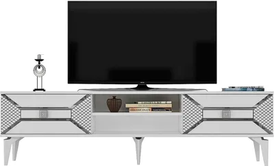 A white TV stand with a black television on top, and decorative items on the stand.