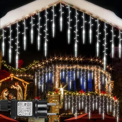 Christmas lights decorating a house at night.