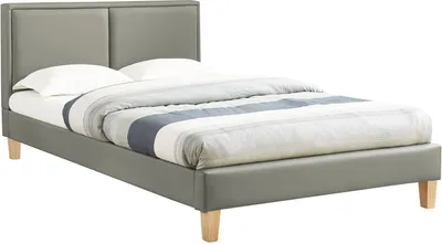 A gray upholstered bed with a mattress and bedding, shown from a side angle against a white background.