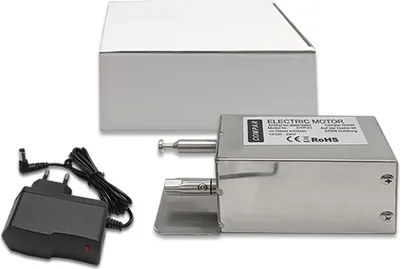 A stainless steel electric motor with a power adapter and a white box.