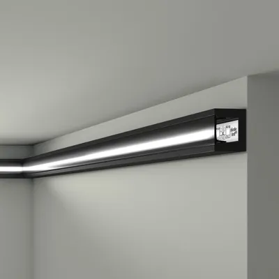A black LED light strip installed along the corner of a ceiling and wall.