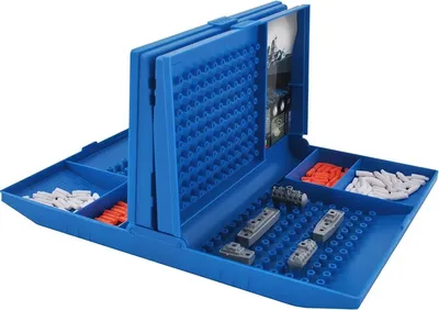 A blue Battleship board game with ships and pegs.