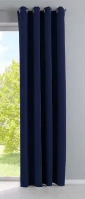 A dark blue curtain hanging in front of a window with trees visible outside.