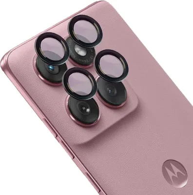Close-up of the rear camera lenses of a pink smartphone, with protective lens covers placed on top of the lenses.