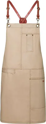 A studio shot of a beige apron with brown leather straps.