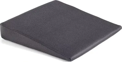 A dark gray wedge-shaped cushion on a white background.