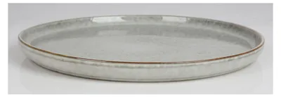 A single ceramic plate shown from a side-diagonal angle on a white and light gray background.