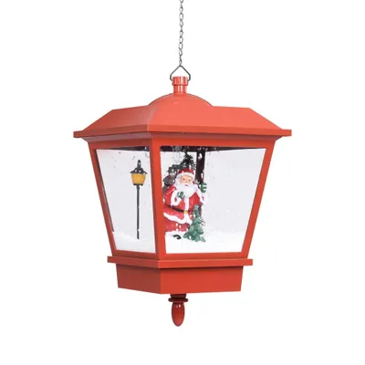 A red Christmas lantern with a Santa Claus figurine inside, suspended by a chain.