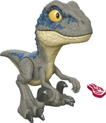 A toy dinosaur with a piece of toy meat.