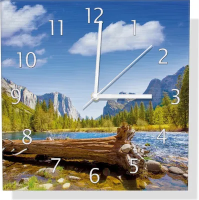 Produktbild von Wallario Design Wanduhr Baumstamm im Fluss zwischen Bergen und Wäldern aus Aluverbund, Größe 30 x 30 cm