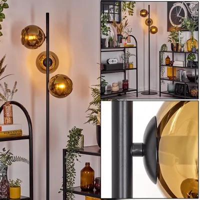 Produktbild von Cesaro Stehlampe aus Metall/Glas in Schwarz/Goldfarben mit Fußschalter