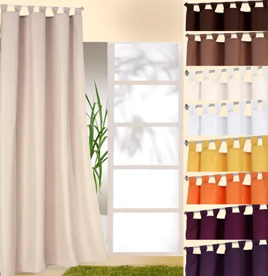 A collage of curtains in various colors, with one large curtain on the left and smaller swatches on the right.