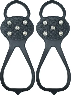A pair of black ice cleats with silver studs.
