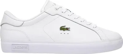 A studio shot of a single white Lacoste sneaker.