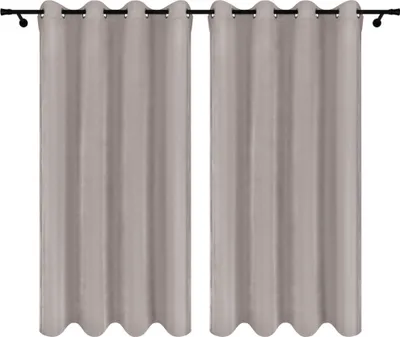 Two gray curtains hanging on a curtain rod.
