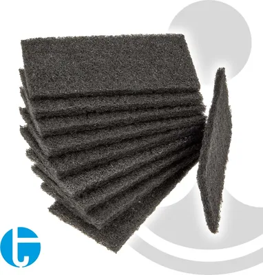 A stack of dark gray cleaning pads with one pad angled to the side, against a white and light gray background.