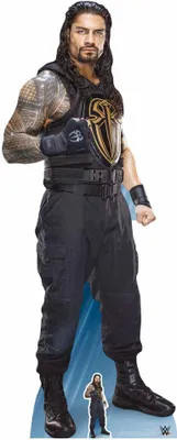 A full-body cardboard cutout of a wrestler, Roman Reigns, standing against a white background with a light blue gradient at the bottom.