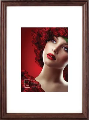 A framed picture of a woman with roses in her hair.
