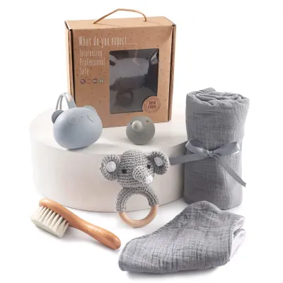 Immagine prodotto di Set regalo per neonati Minicee da 7 pezzi, set regalo per la nascita con anello da dentizione, cordino per ciuccio e copertina, motivo elefante, regalo per baby shower