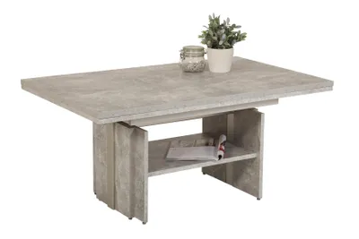 A coffee table with a shelf underneath, decorated with a plant and a jar.