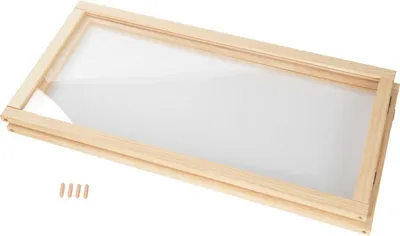 A wooden frame with a clear perspex sheet inside, shown at an angle on a white background. Several wooden dowels are placed to the left of the frame.