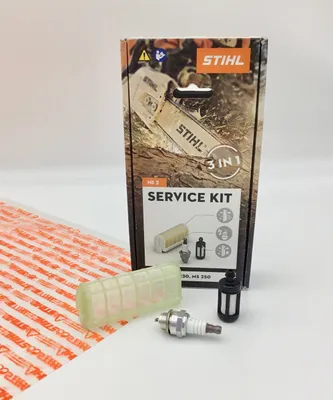 A STIHL service kit for chainsaws is displayed on a white background, with the packaging and individual components laid out.